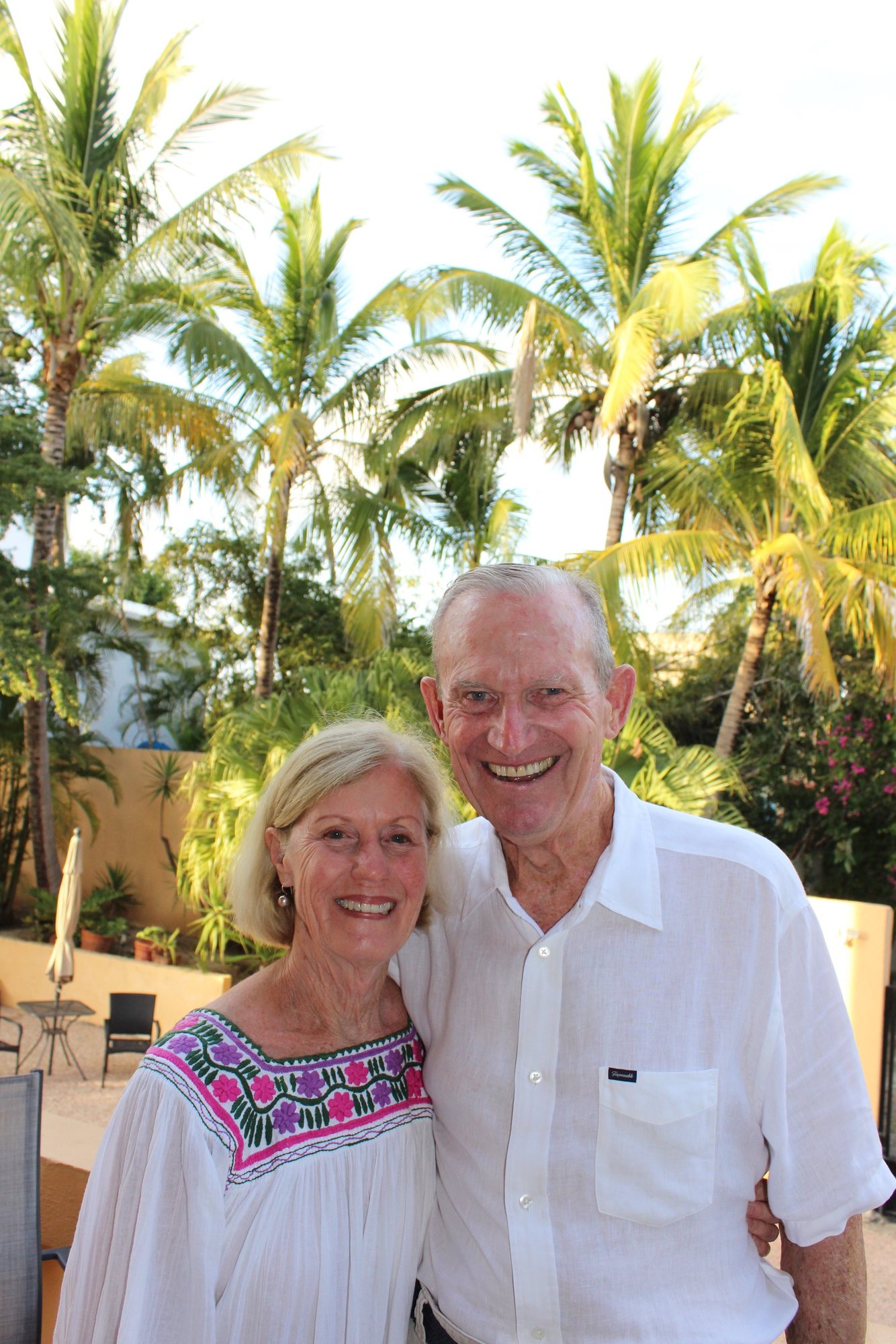 Susan and Tim, Casa Caballo's owners, under the palms